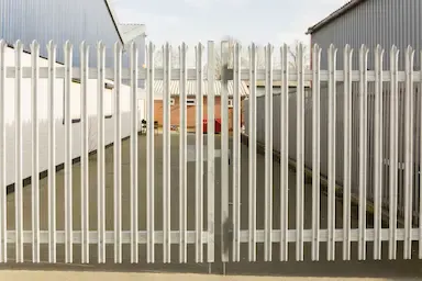 A white Metal Gate and Fence Installed Cleanly In Essex UK