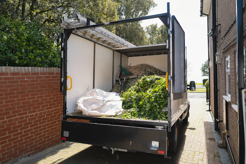 Cut Green Hanging and Green Waste In the Back of small Pickup