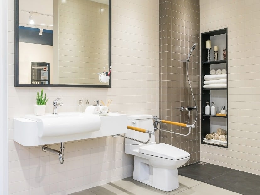 A modern bathroom with a toilet, sink, and mirror Fixed and cleaned properly somewhere in Essex England UK
